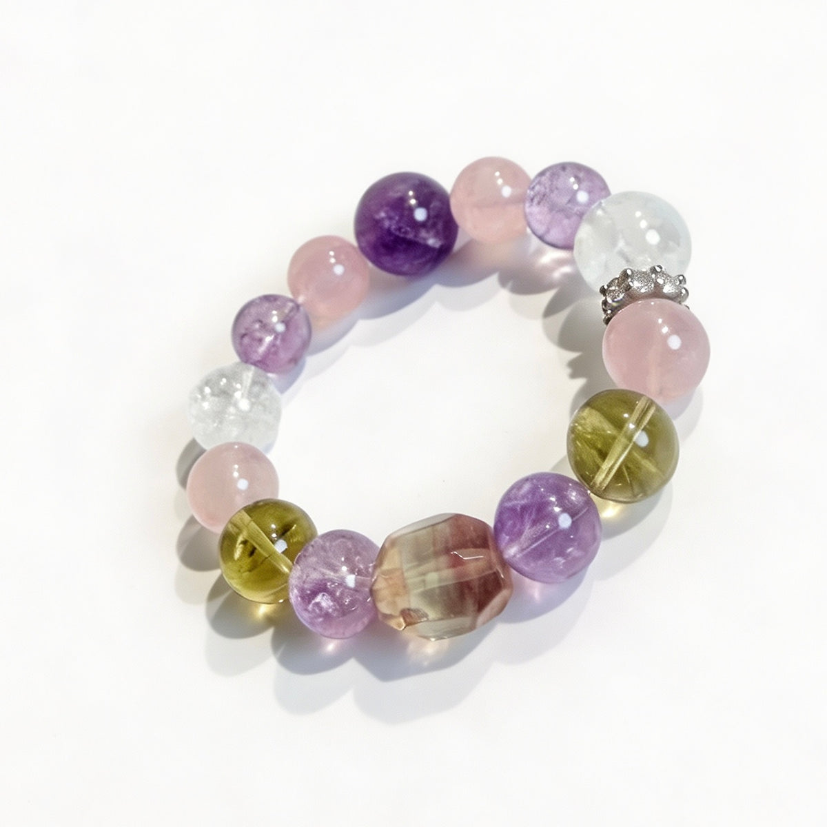 Close-up of a multicolor crystal bracelet with purple amethyst and pink rose quartz beads