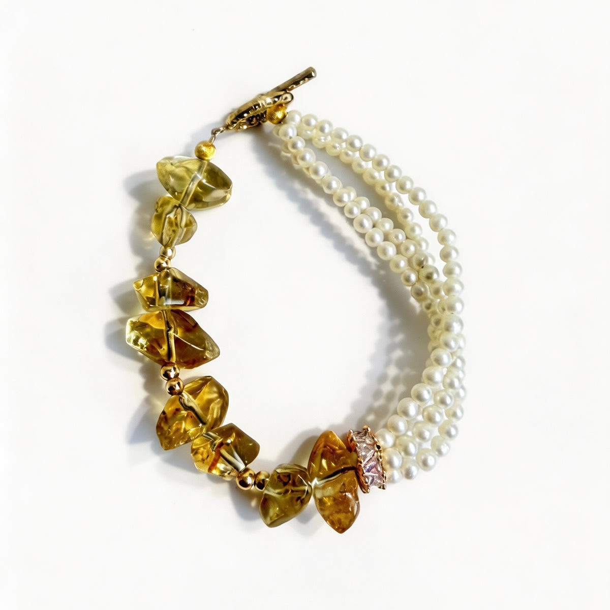Multi-strand freshwater pearl bracelet with natural raw-cut citrine beads and gold-tone clasp