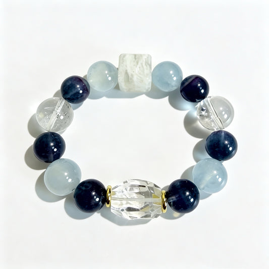 Aquamarine and blue fluorite bracelet with a square snowflake phantom quartz bead and gold-tone spacers