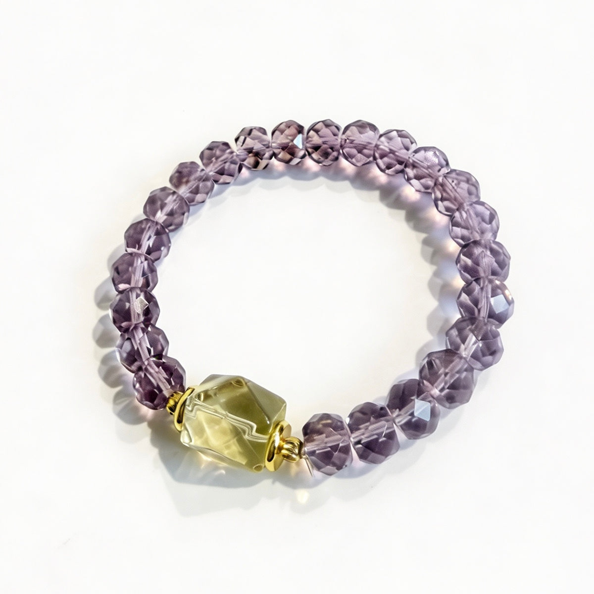 Faceted amethyst bracelet with a yellow lemon quartz focal bead and gold-tone accents