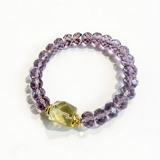 Faceted amethyst bracelet with a yellow lemon quartz focal bead and gold-tone accents