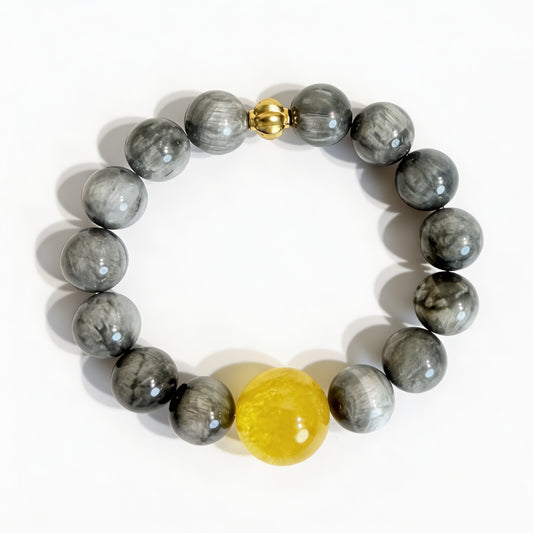 Grey eagle eye bracelet with a yellow citrine focal bead and gold-tone accent