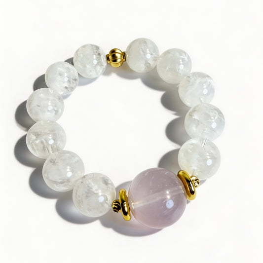 Snow phantom quartz bracelet with a pink rose quartz focal bead and gold-tone accents